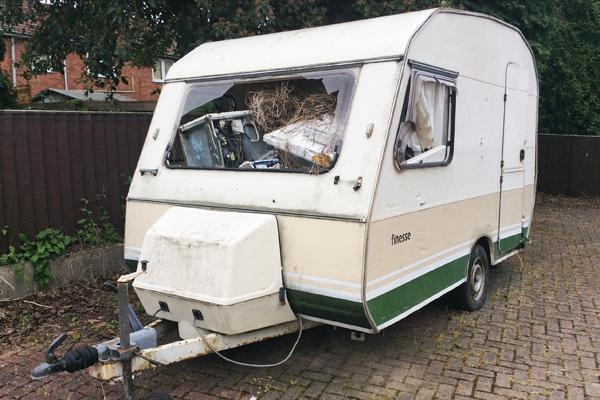 Fly tipped caravan filled with rubbish - prosecution