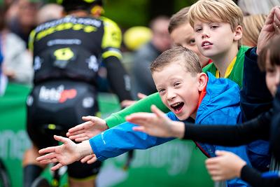 Tour of Britain cheering Children waving on the cyclists