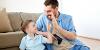 Carer and young boy happy playing