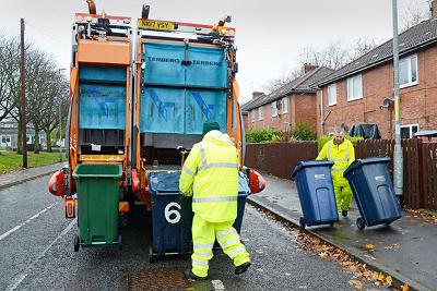 Recycling vehicle winter shot of recycling truck on rounds