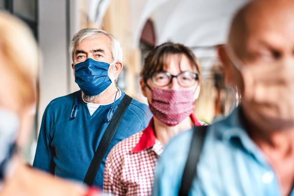 People queuing wearing facemarks