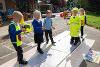 Children role-playing safe road crossing