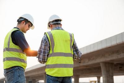 Workers in hard hats and hi vis