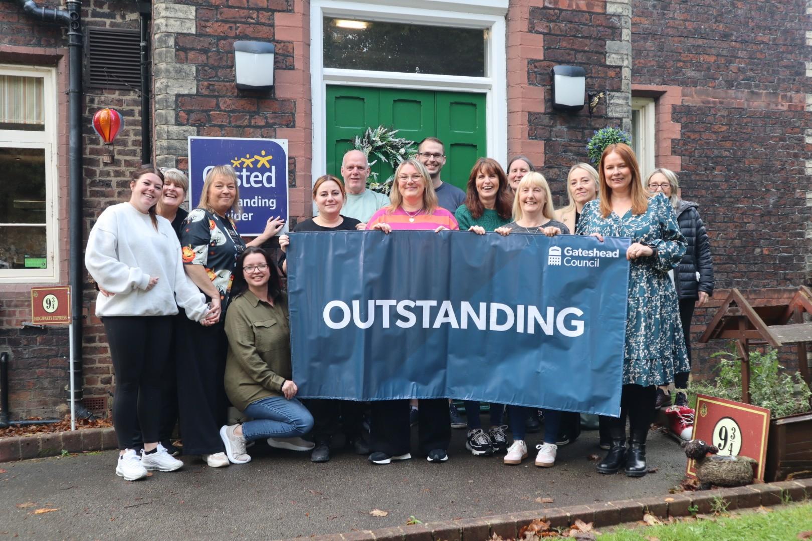 Grove House staff celebrate their Outstanding Ofsted rating